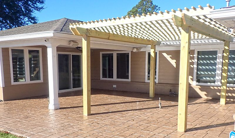 Custom wood pergola installation by Right At Home Construction LLC