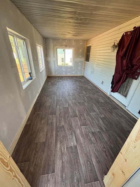 Interior of a custom built patio room by Right At Home Construction LLC, featuring a comfortable outdoor living space.