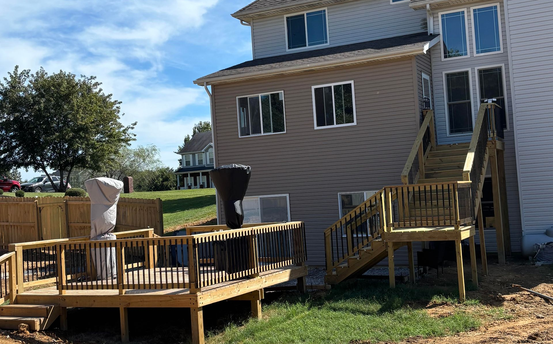 Custom wood deck, Wood privacy fence,  and enclosed patio room installation by Right At Home Construction LLC in Central KY