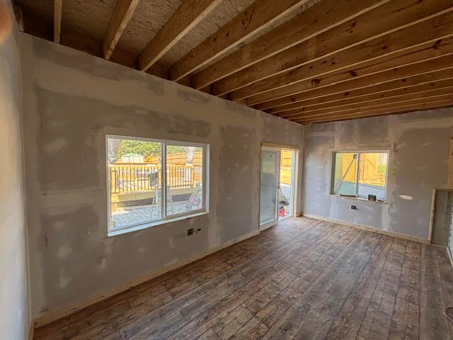 Interior of a custom built patio room by Right At Home Construction LLC, featuring a comfortable outdoor living space.