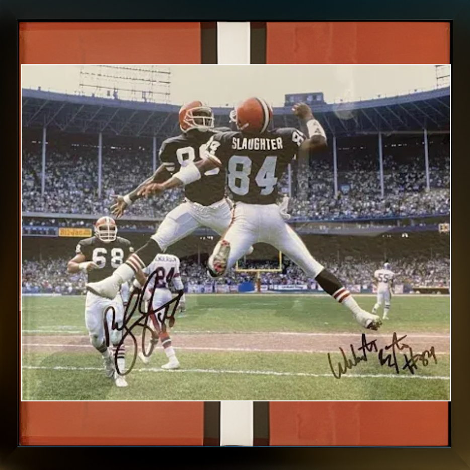 Framed photo of two Cleveland Browns football players celebrating a touchdown. Orange and brown team colors.