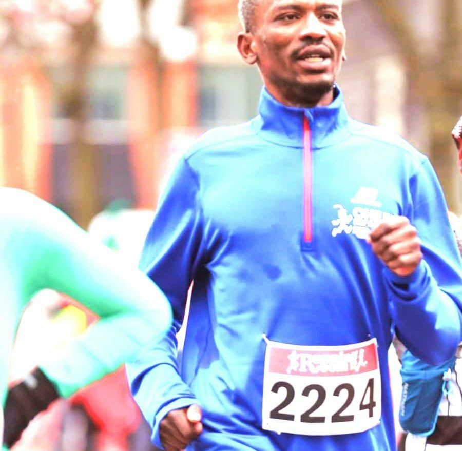 Runner in blue, participating in a race, wearing bib number 2224.