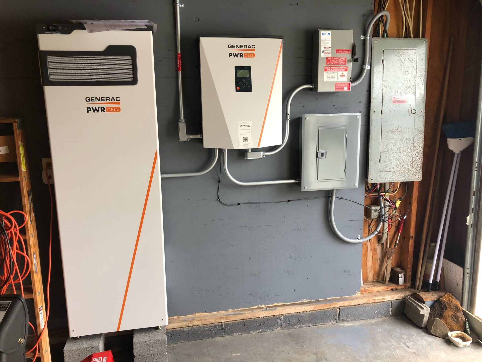 a garage with a lot of electrical equipment on the wall 