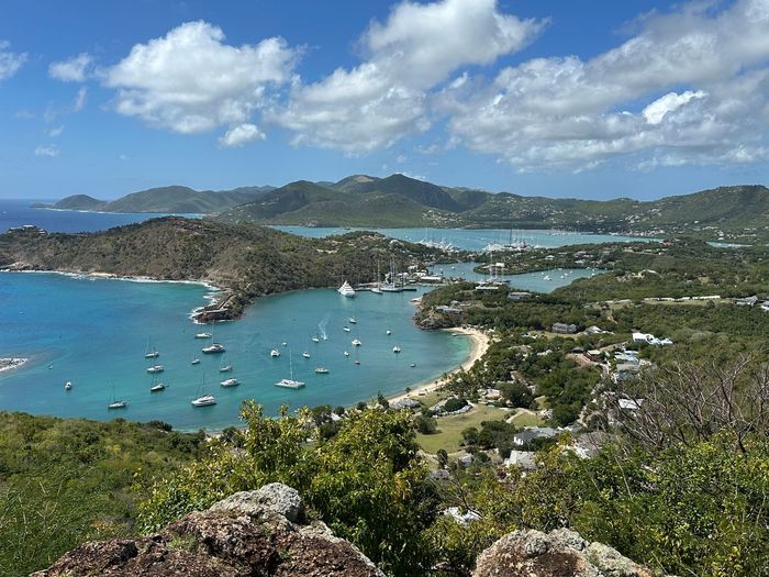 Picture of the hills and coastline of the island of Antigua and Nelson's Dockyard & marina. 