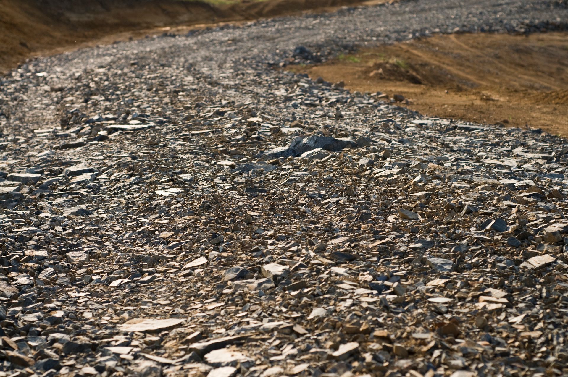 A pile of rocks on a dirt road