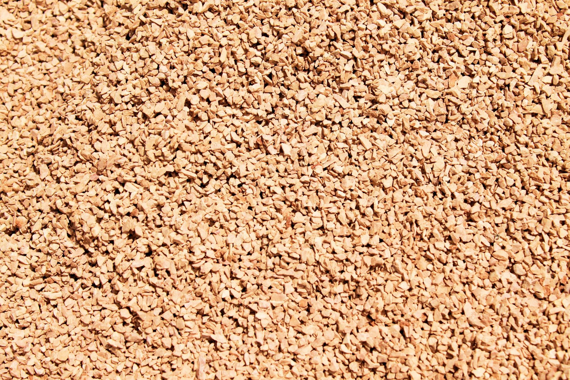 It is a close up of a pile of red granite.