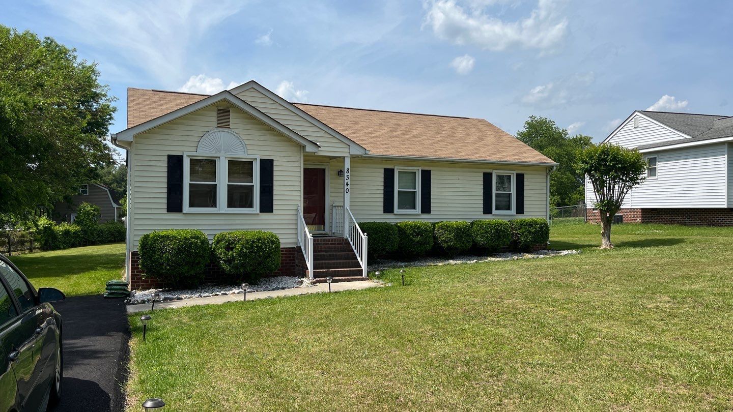 A before image of a RETEX siding replacement on a Mechanicsville VA home. This image shows the frontside of the house.