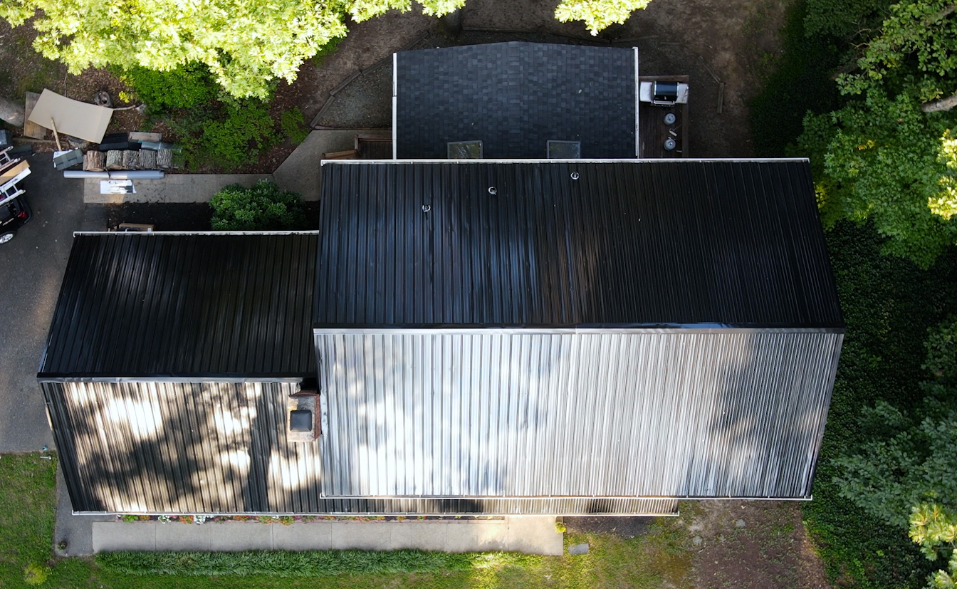 Aerial drone image of RETEX black ribbed metal roof replacement in North Chesterfield, VA 23235.