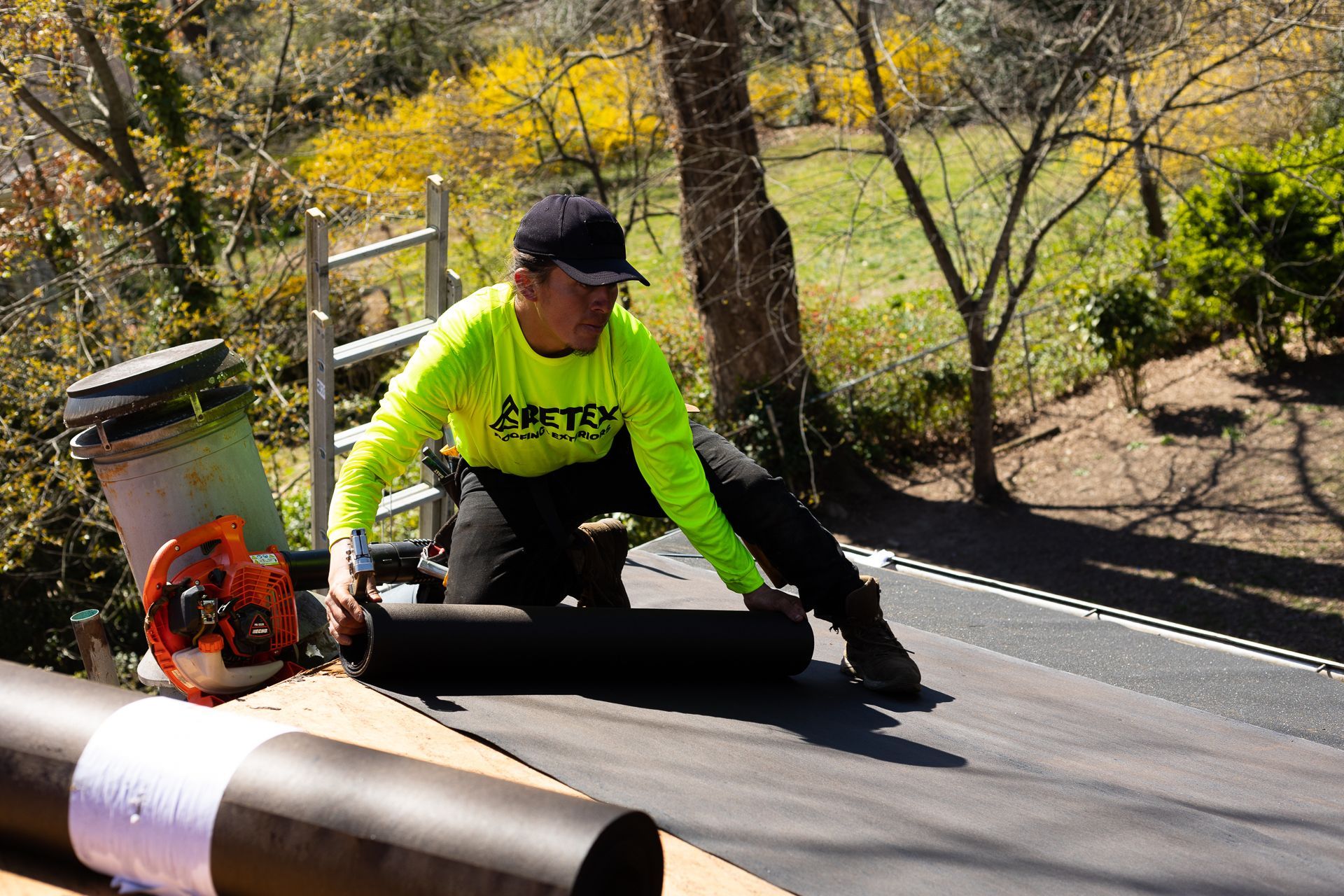 A RETEX crew member installs underlayment during a roof replacement in North Chesterfield VA 23235.