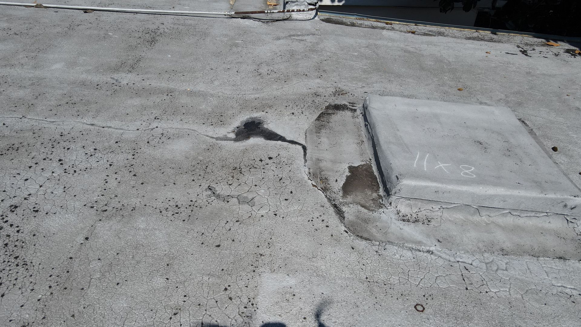 Image of old, damaged flat roof in Richmond VA.