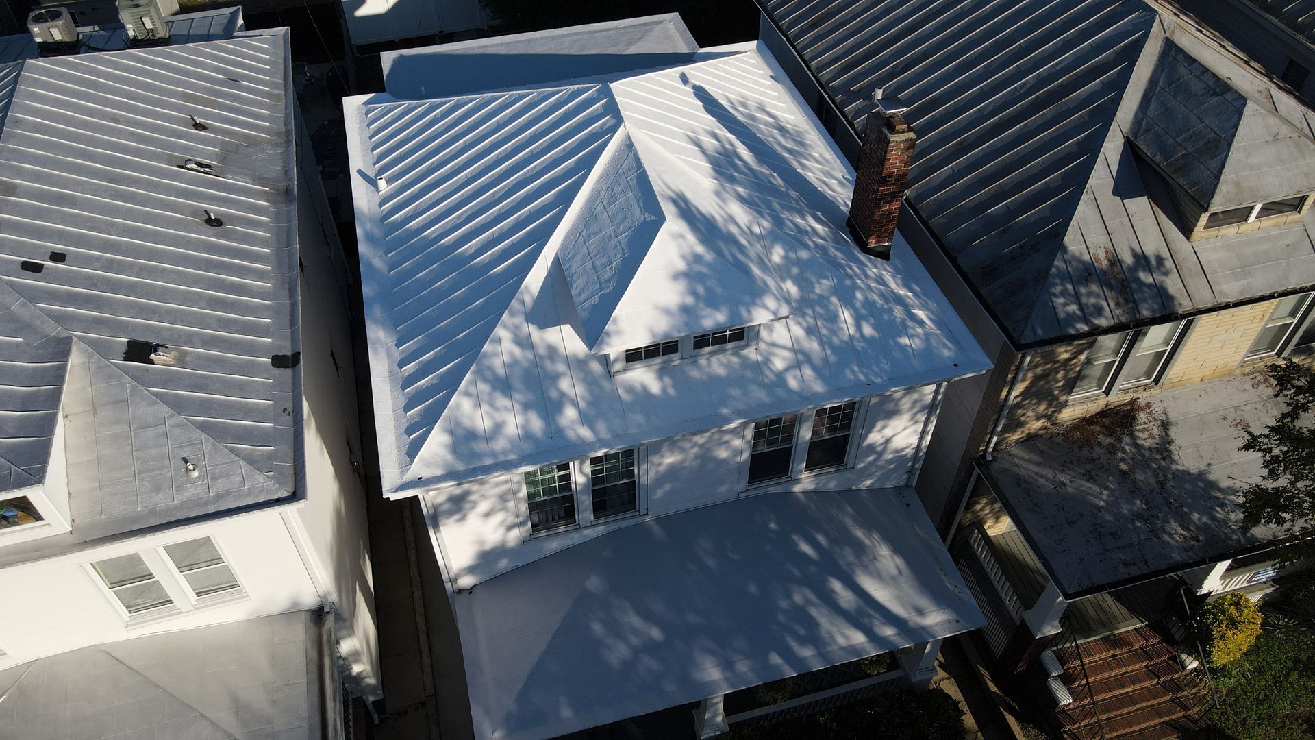 A drone aerial image of a RETEX metal roof recoating in Richmond, VA's Chimborazo neighborhood. 