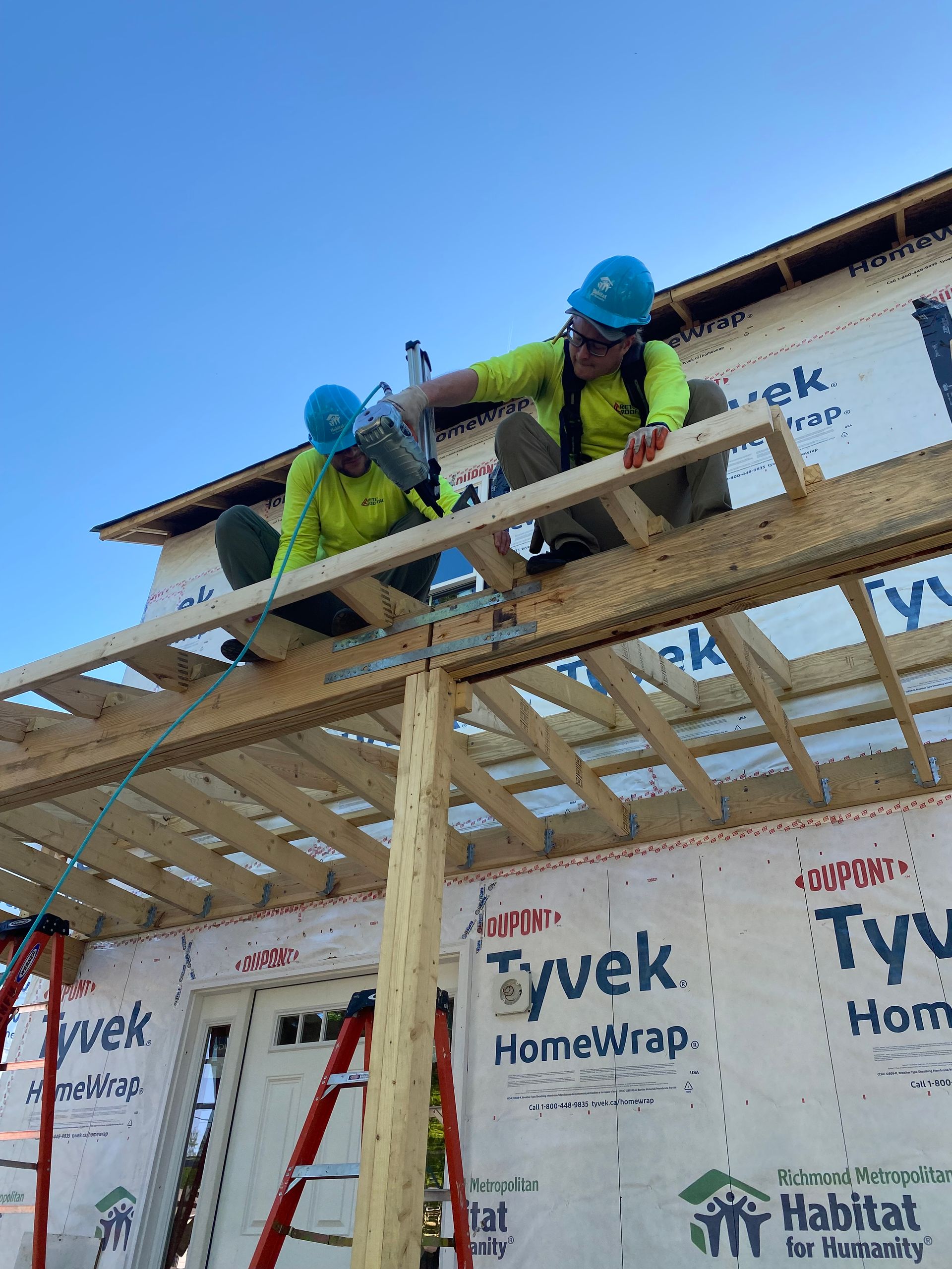 Image of RETEX’s Andy Connor and Josh Lewis volunteering with Richmond Habitat for Humanity in April 2023.