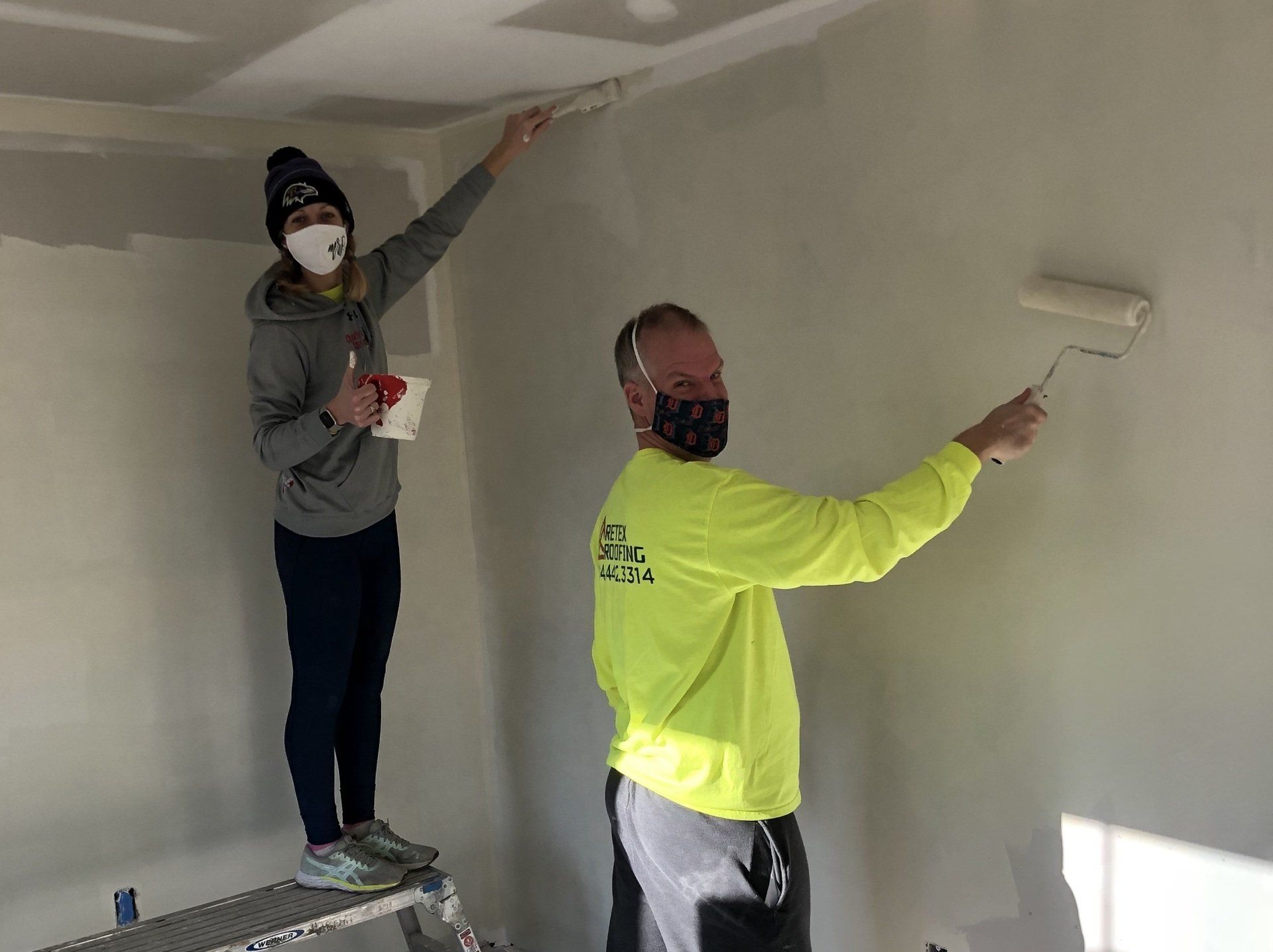 Image of RETEX’s Katelyn Lewis and Mark Erickson volunteering with Richmond Habitat for Humanity. 