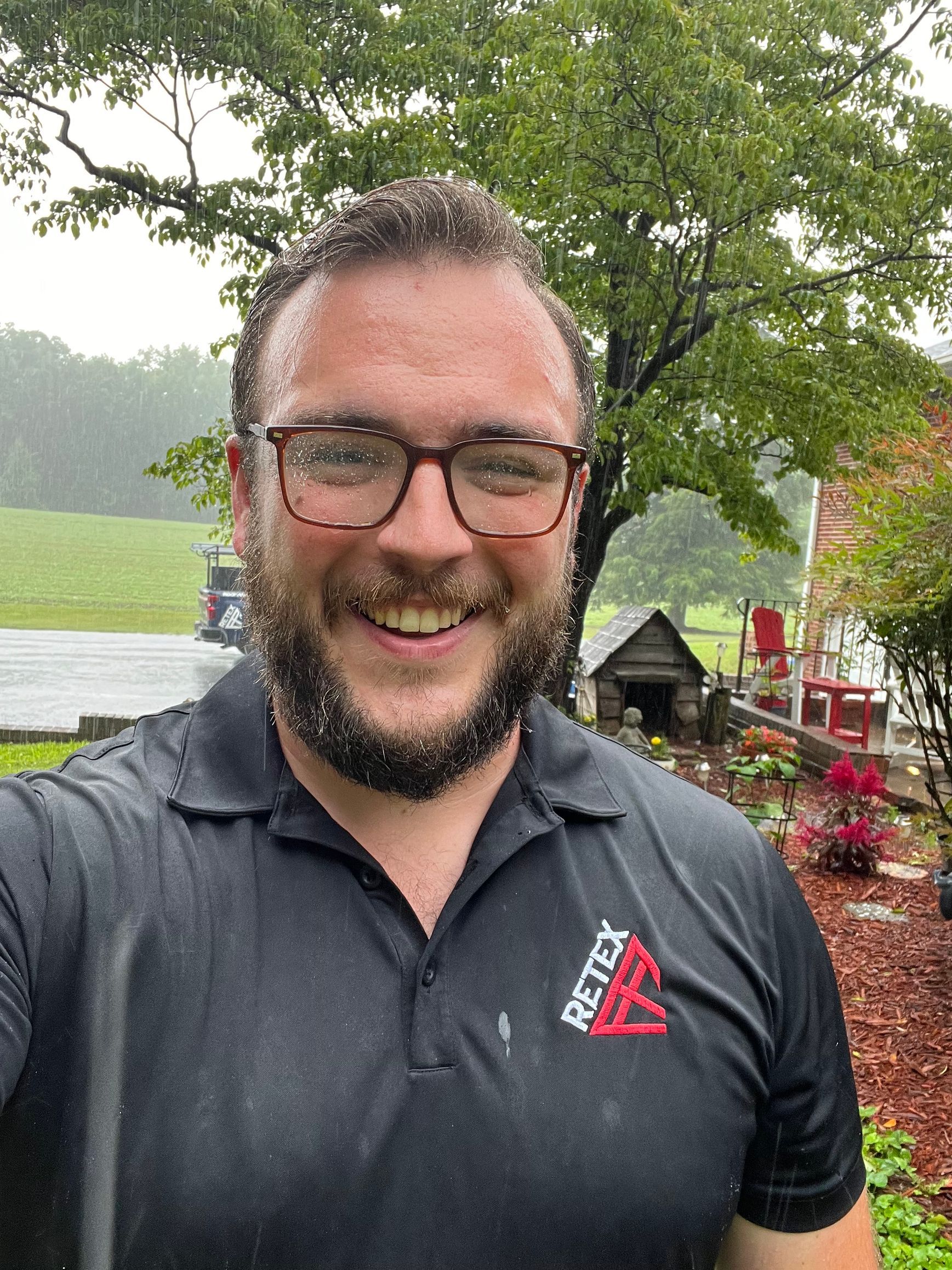 Selfie image of RETEX's Andy Connor, drenched from getting caught in the rain during an appointment.