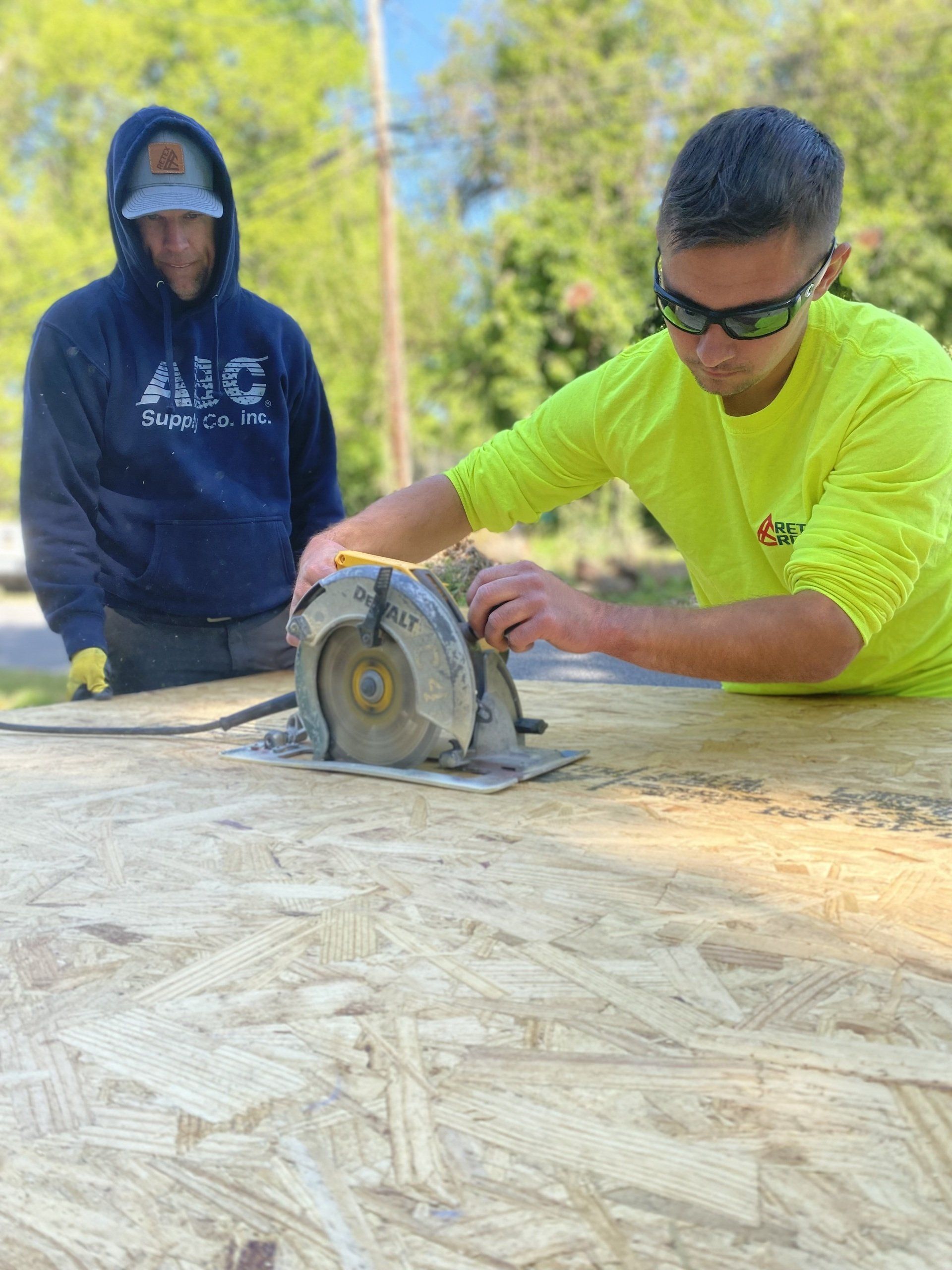 Image of RETEX’s Cale Kammerling and Mark Erickson volunteering with Richmond Habitat for Humanity in April 2022.