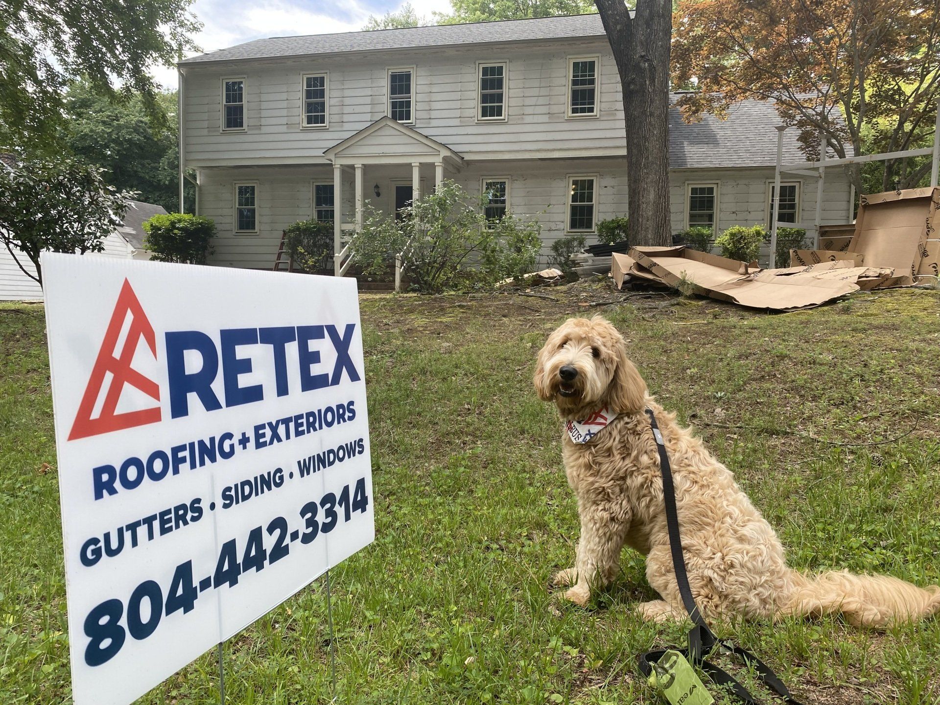 Before photo of RETEX's Albus Lewis in front of a home that RETEX replaced the roof, siding, windows and gutters for in 2022.