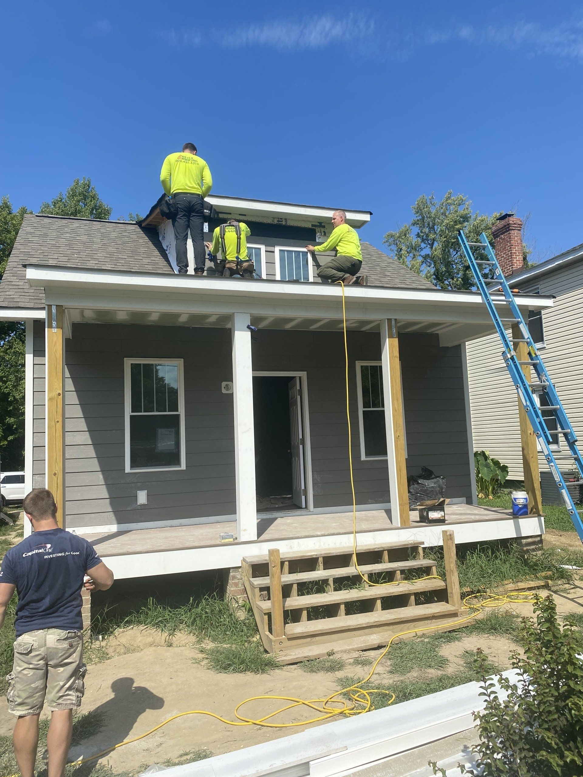Image of RETEX’s Caleb Hennon and Mark ERickson volunteering with Richmond Habitat for Humanity in August 2022. 
