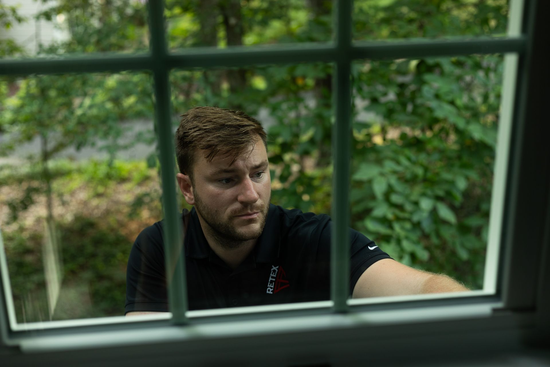 RETEX's Josh Lewis assesses a window replacement project in North Chestefield VA