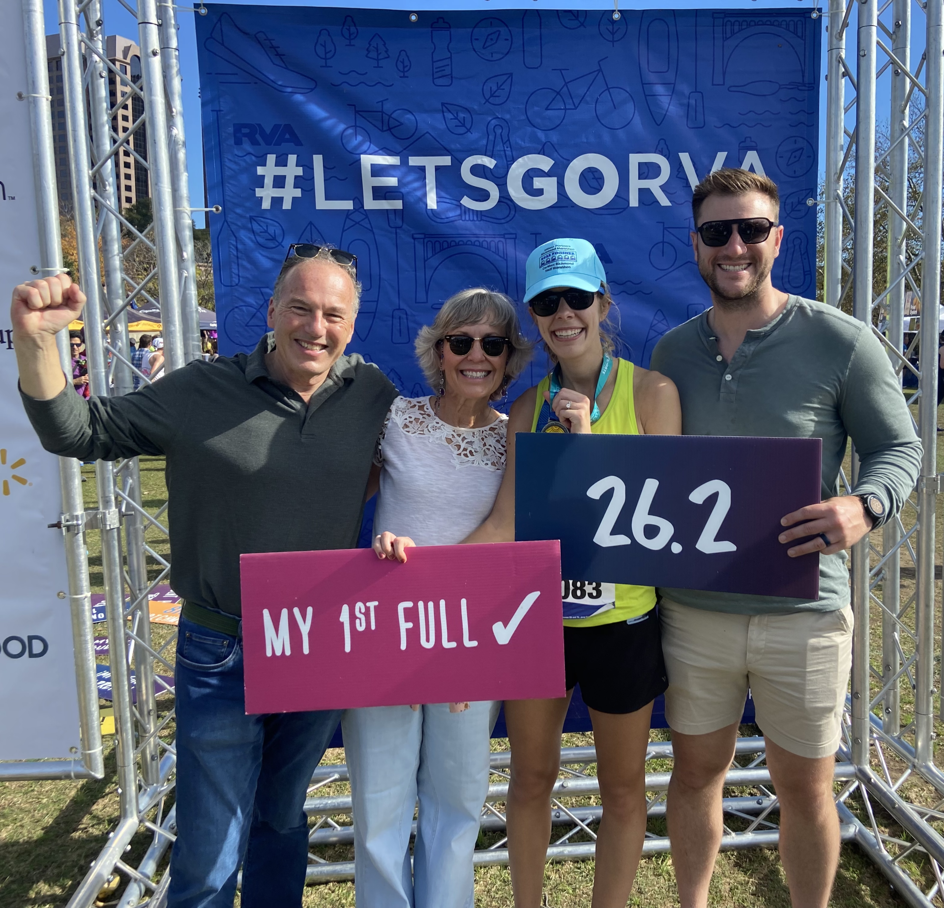 Image of RETEX's Katelyn Lewis with family members after running the Richmond Marathon in November 2022.