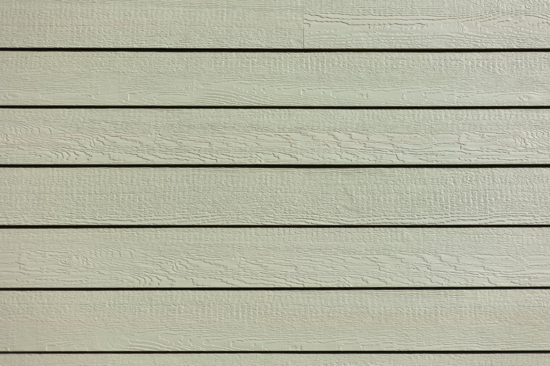 A close-up image of newly installed LP Smartside siding on a Richmond VA home.