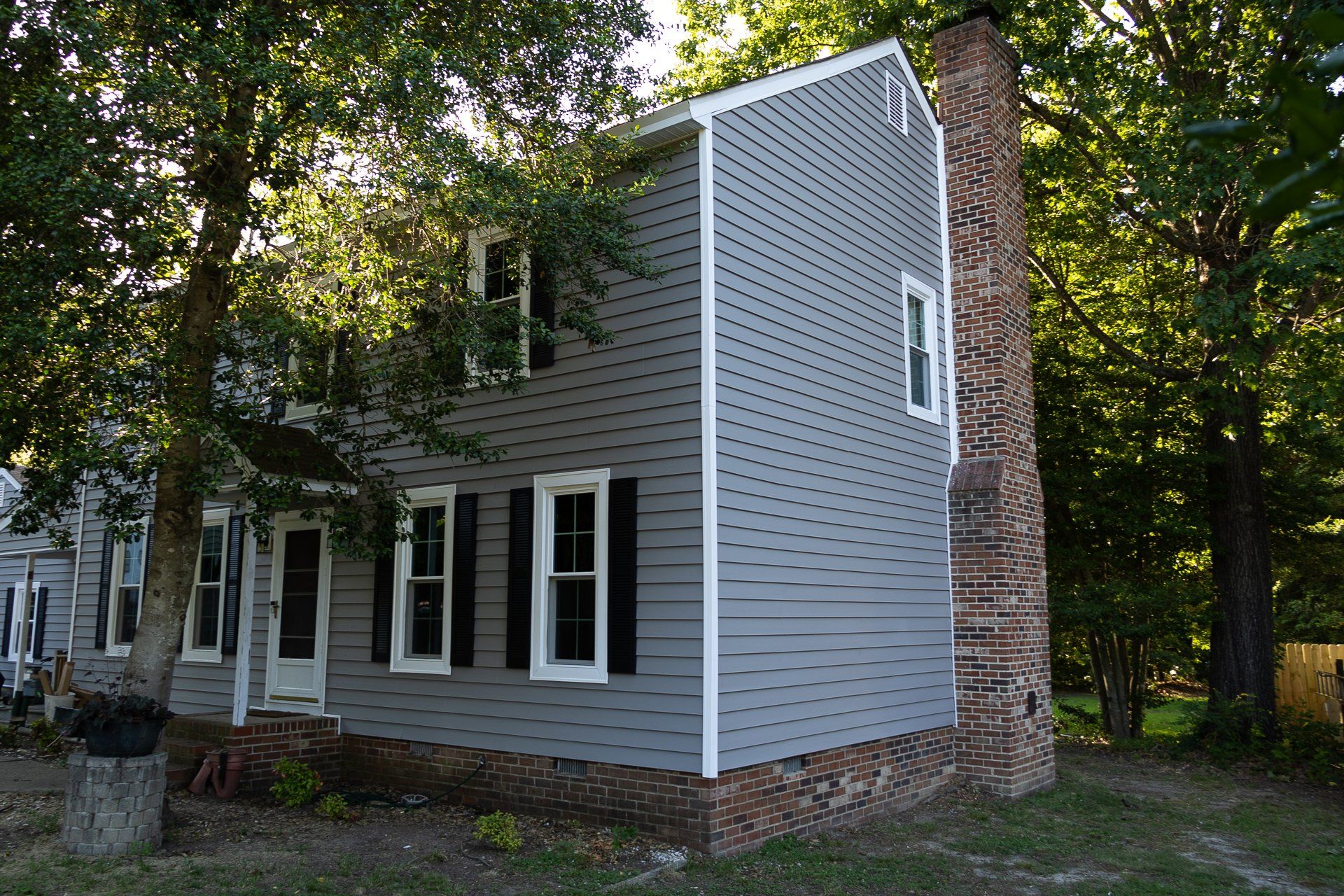 After photo of RETEX insulated vinyl siding and window replacement in North Chesterfield VA 23235.