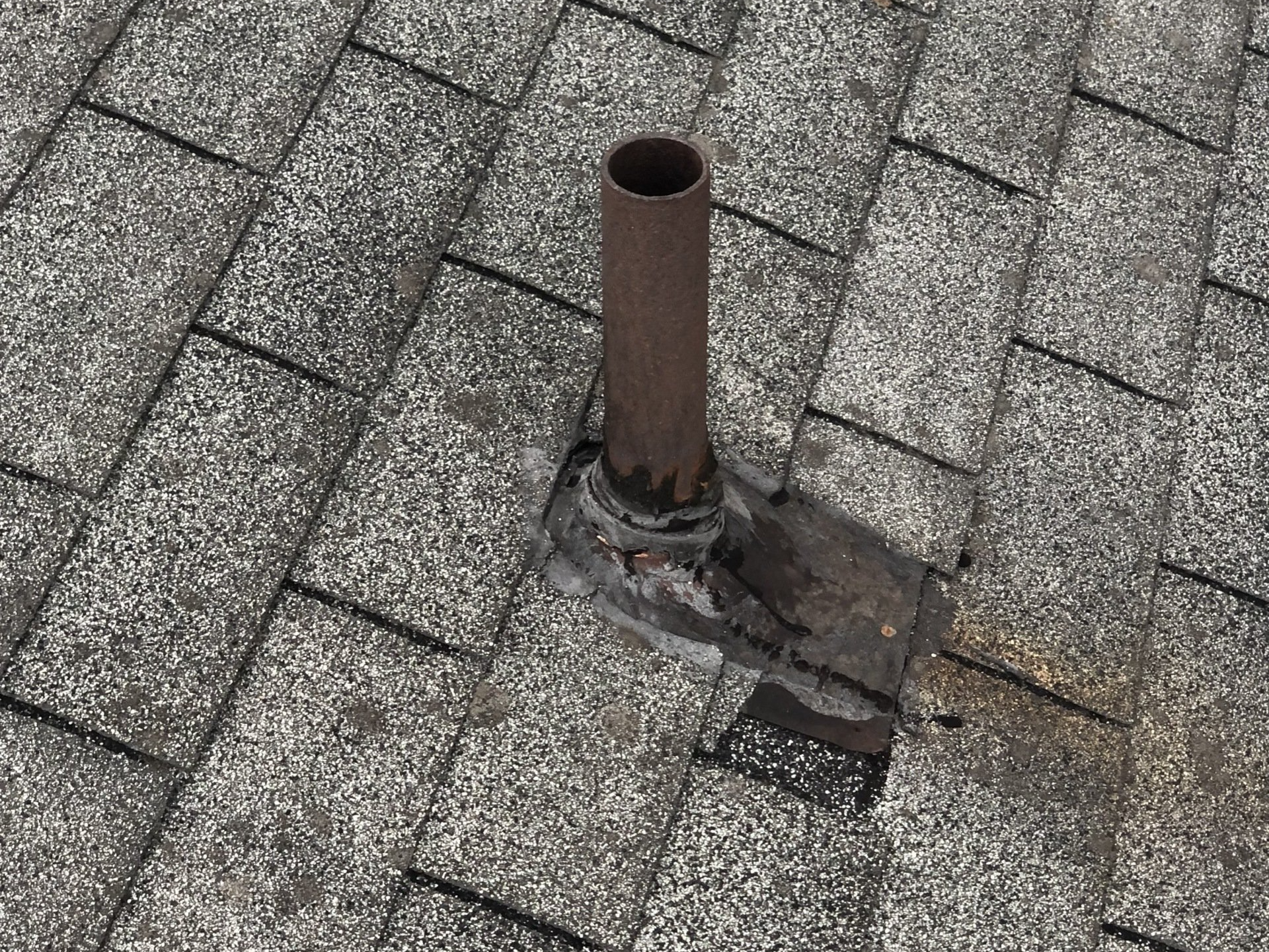 Old pipe collar on roof in Richmond, VA.