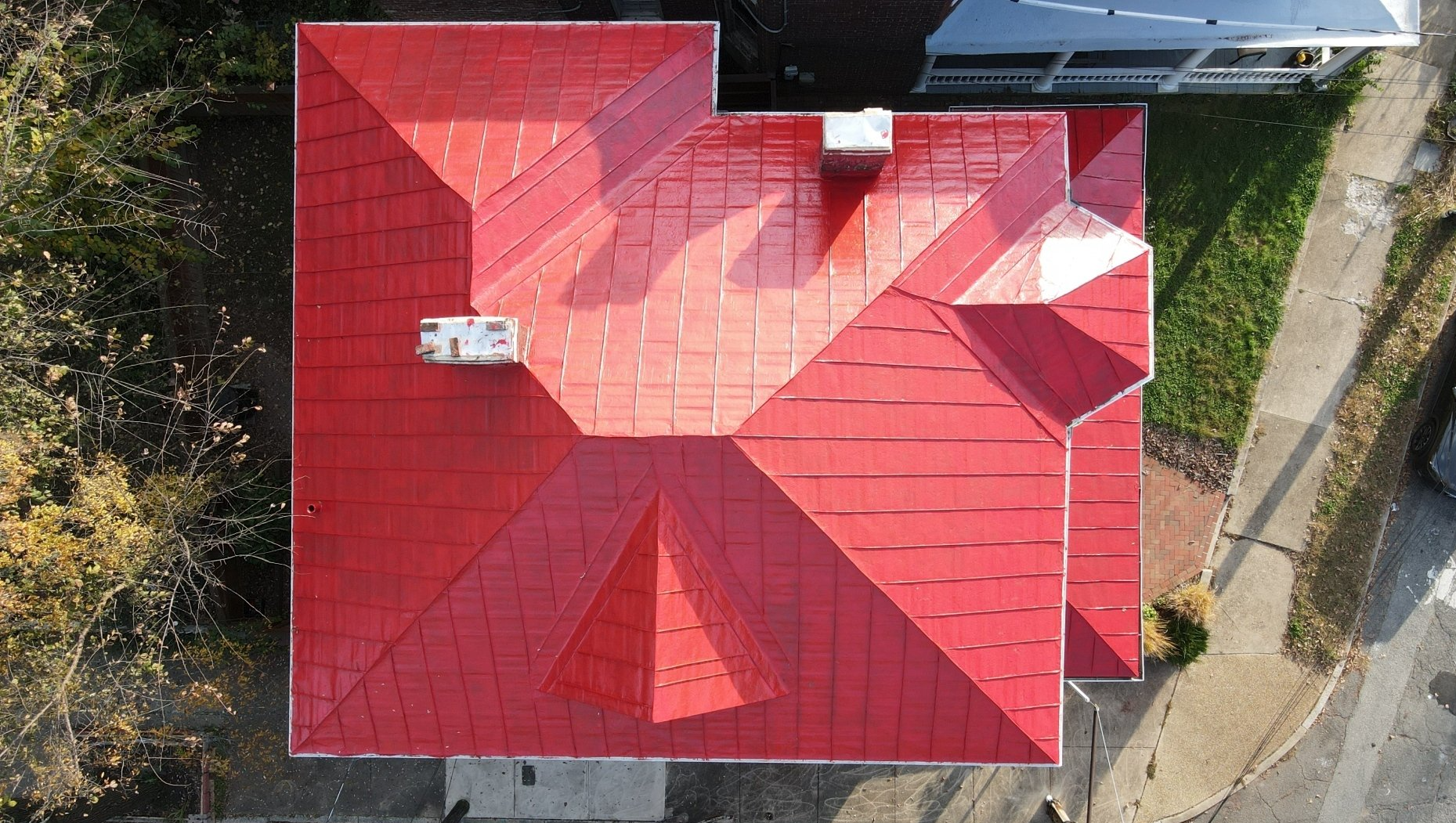 Aerial after-coating image of a RETEX ribbed metal roof recoating in Richmond VA.
