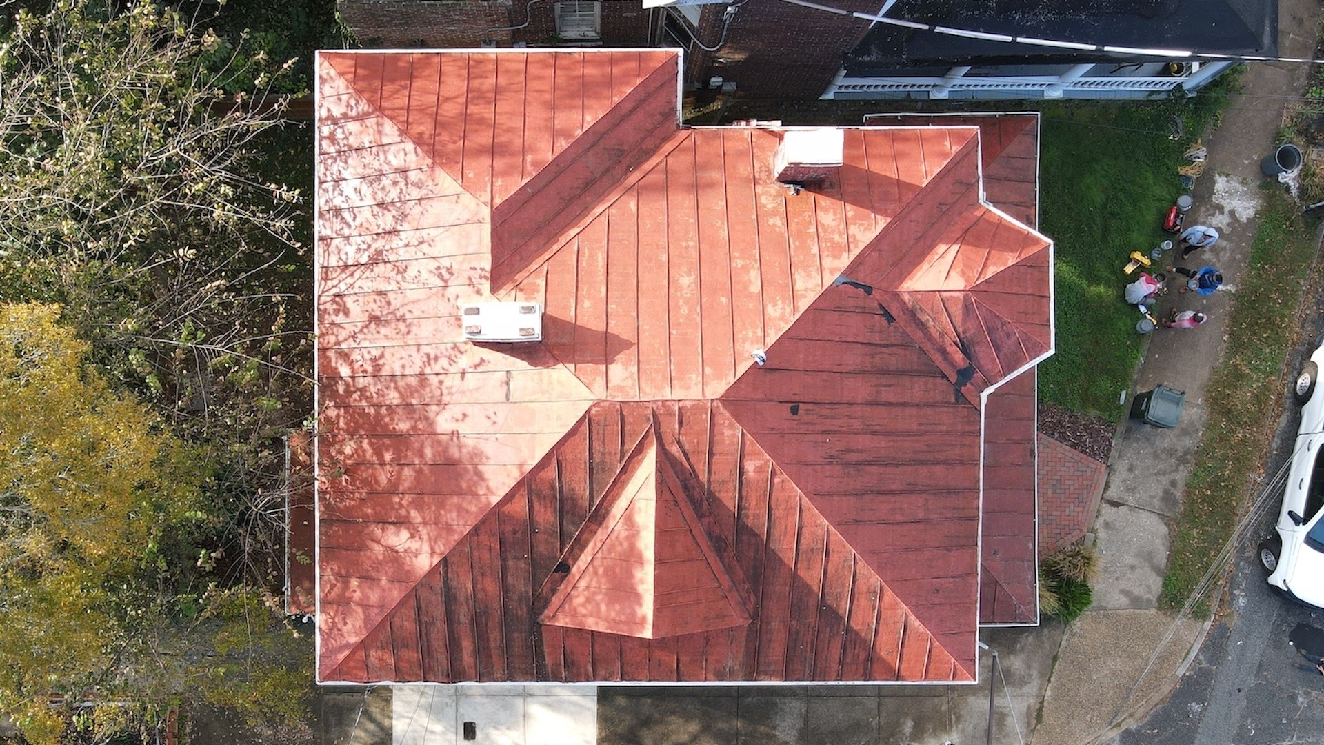 Aerial before-coating image of a RETEX ribbed metal roof recoating in Richmond VA.