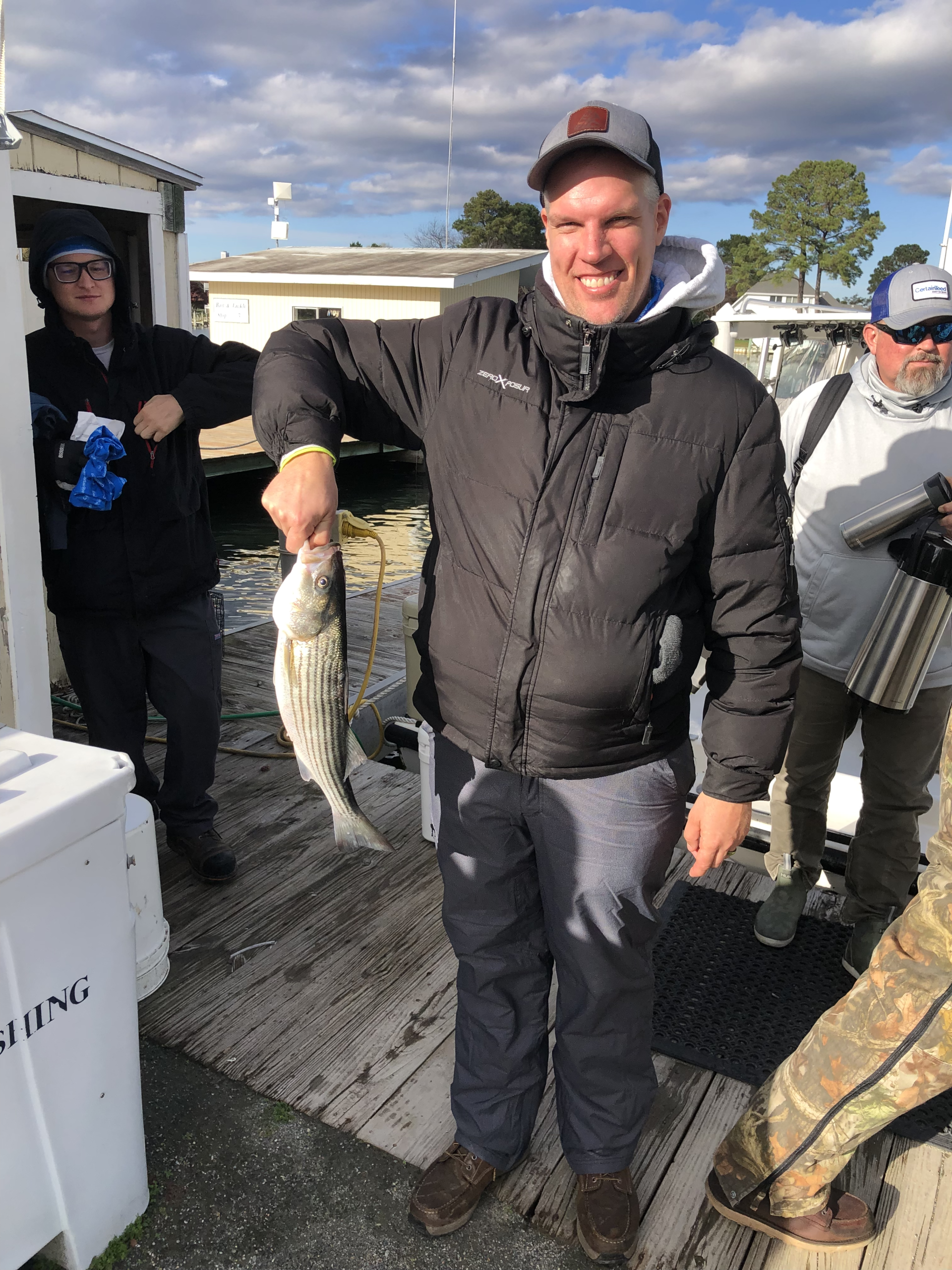 Image of RETEX's Mark Erickson holding a fish during a Chesapeake Bay trip with material supplier Superior Distribution.