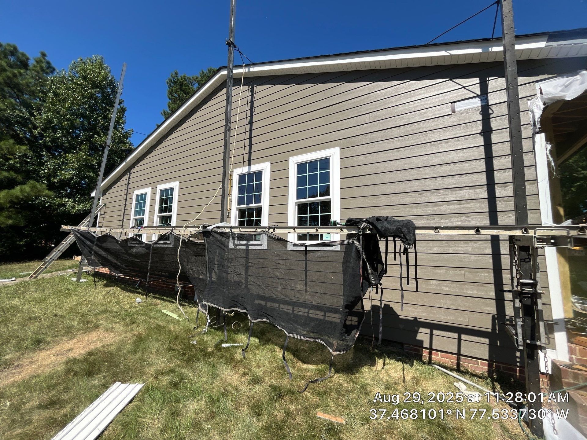 RETEX installs new siding at its Hull Street office location, August 2025.