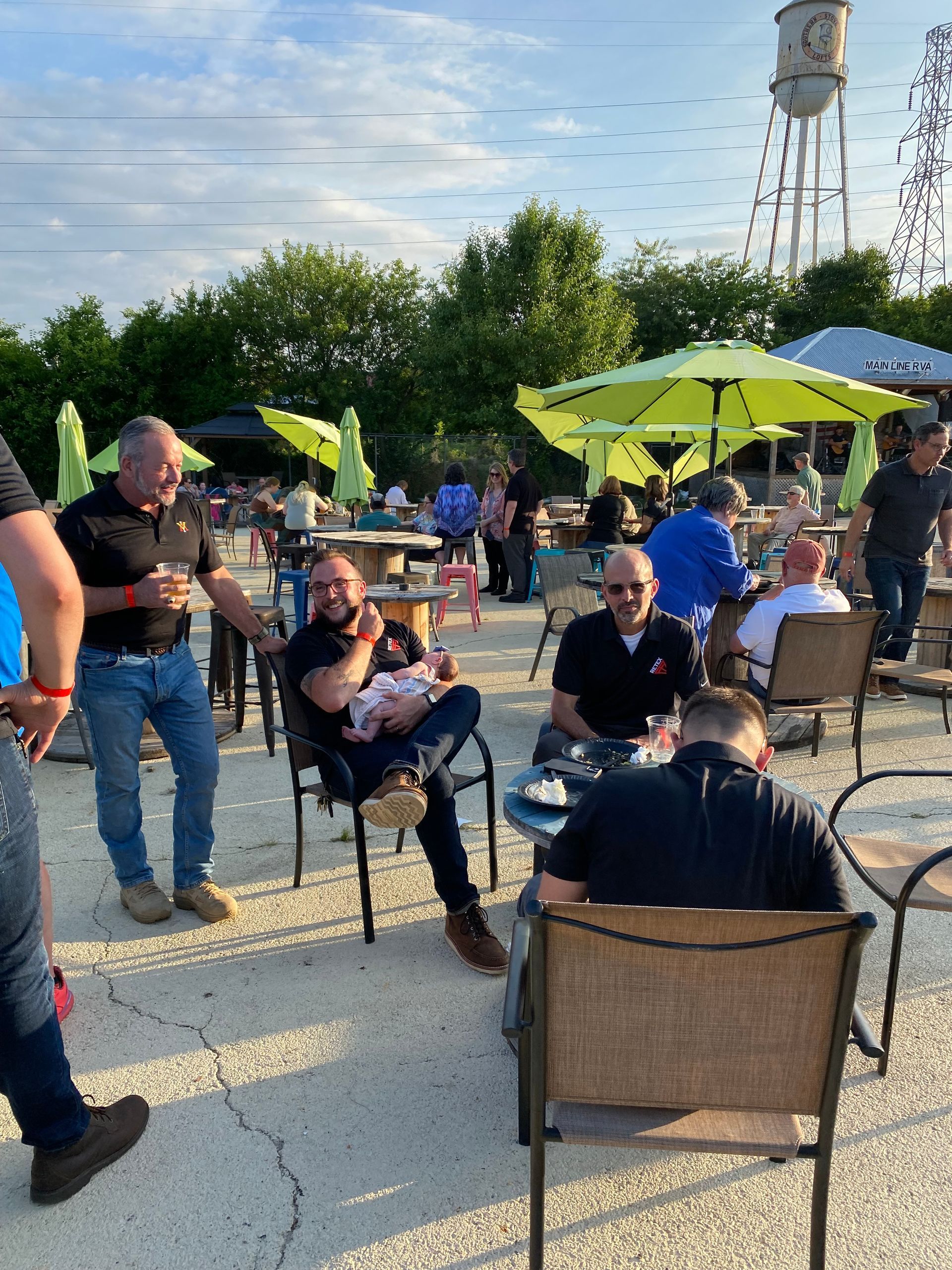 An image of RETEX's Andy Connor and Mark Scarpino chatting with past clients at our June Client Appreciation event in 2023.