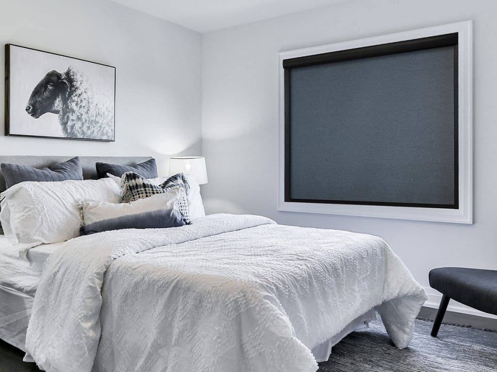 Graber® Blackout Roller Shades in Bedroom.