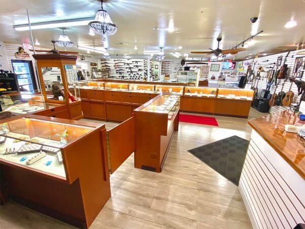 A large jewelry store filled with lots of display cases.