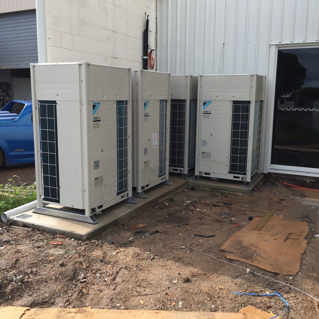 Four large Commercial Air Conditioning Units outside of a factory outlet — PRO COOL NT In Virginia, NT
