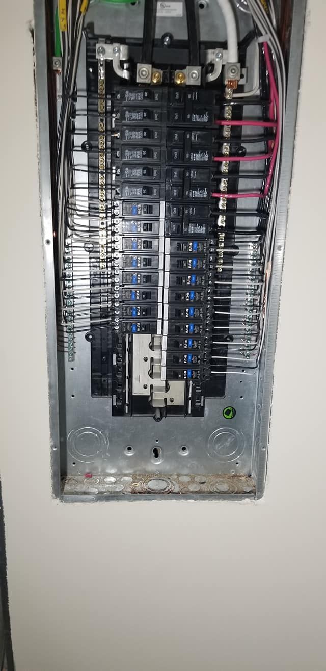 A close up of a electrical panel on a wall.