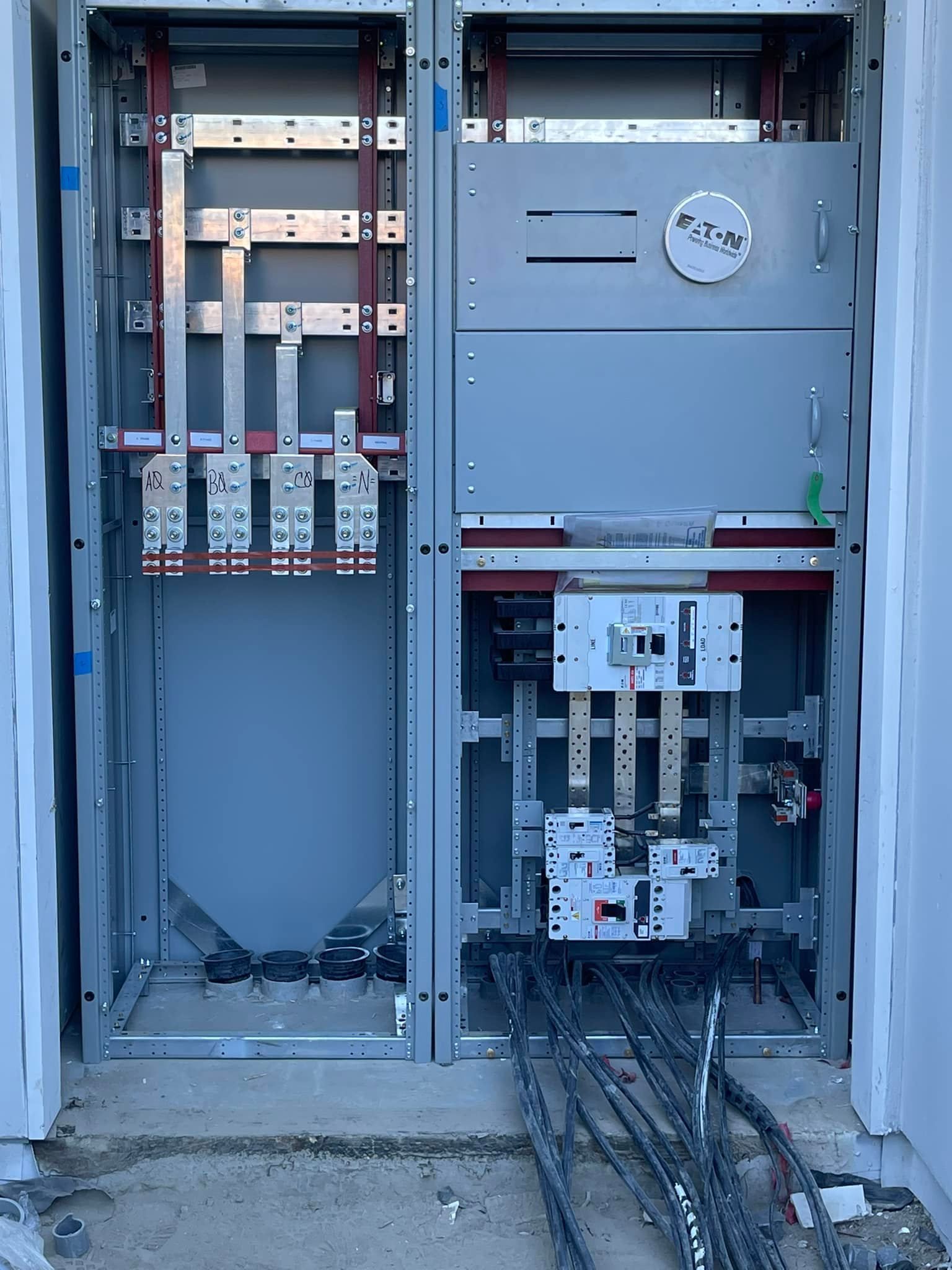 A large electrical box with a lot of wires coming out of it.