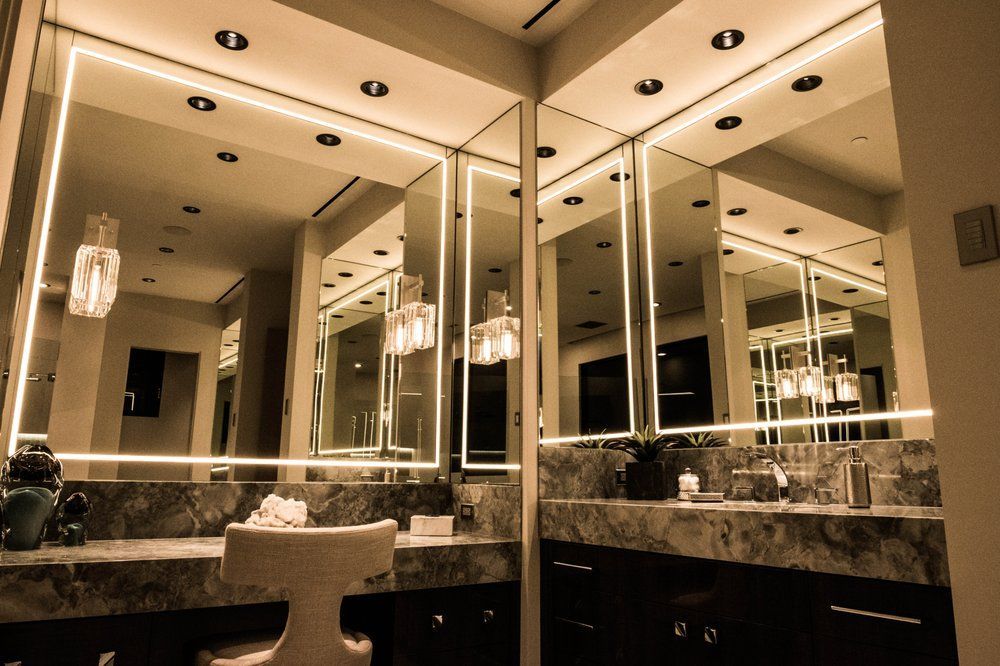 A bathroom with two sinks and a large mirror