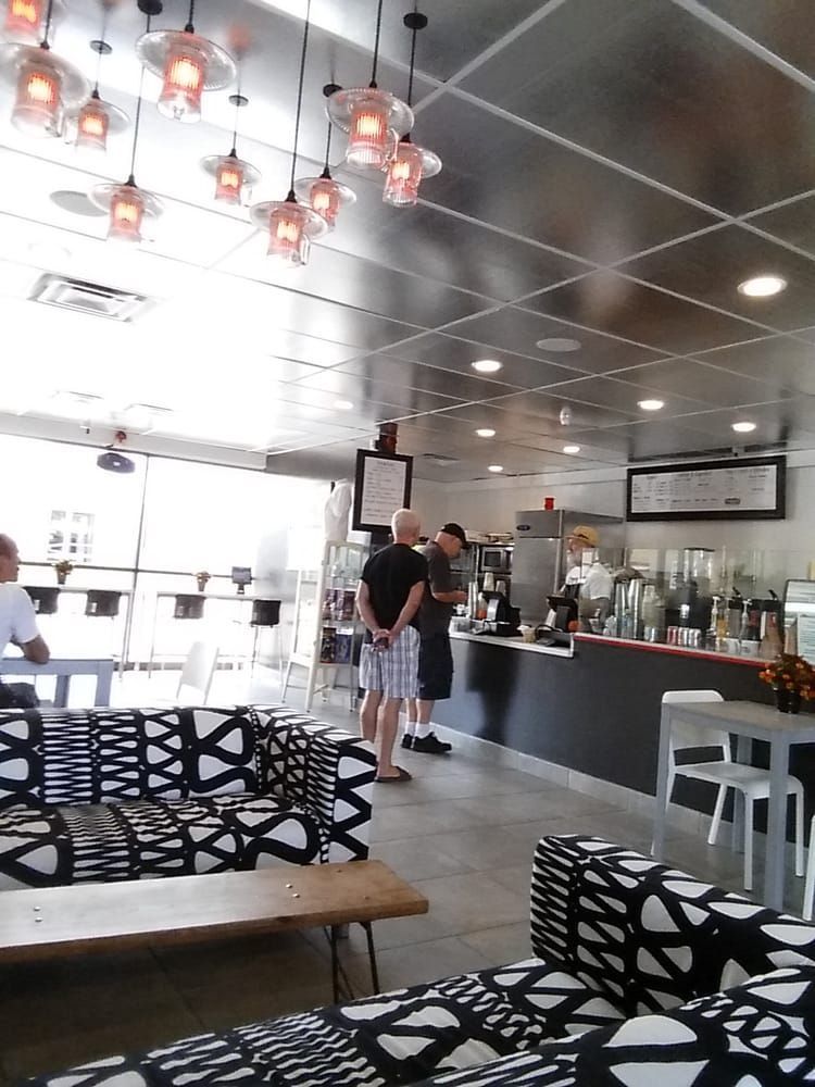 A restaurant with a ceiling that has a lot of lights on it