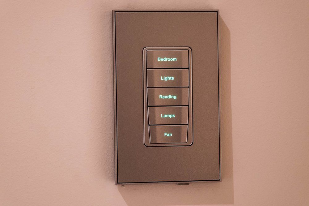A close up of a light switch on a wall