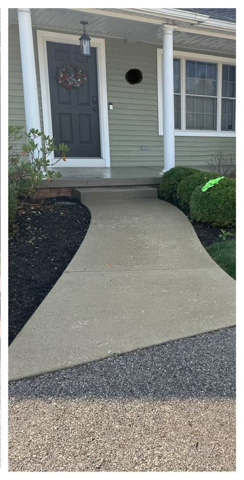 Pressure washing the sidewalk, porch and concrete after clean
