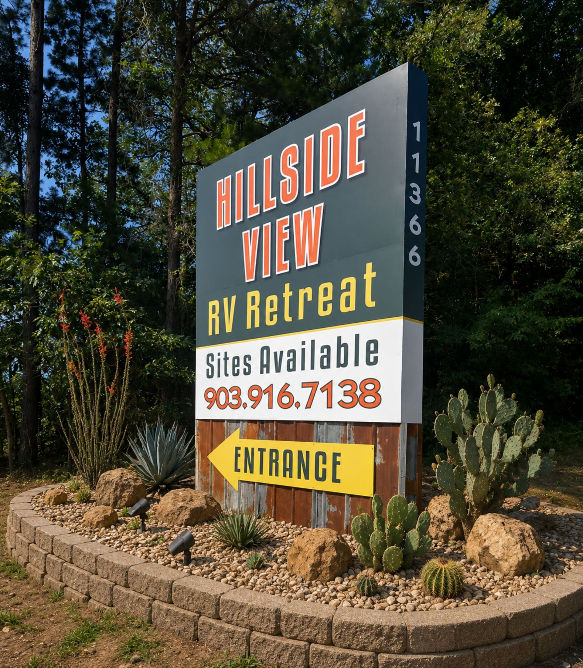 Hillside View RV Retreat sign with site availability and entrance, bordered by desert landscaping