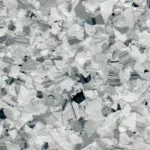 A close up of a gray and white granite counter top.