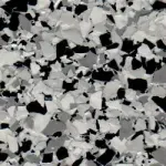 A close up of a black and white granite floor.