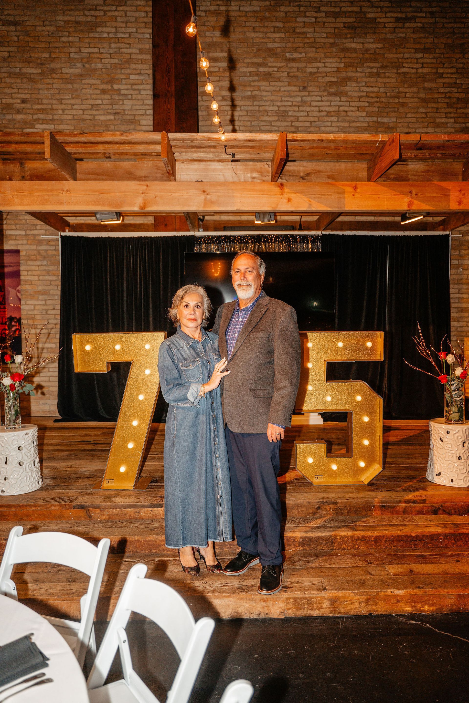 Couple standing in front of illuminated 