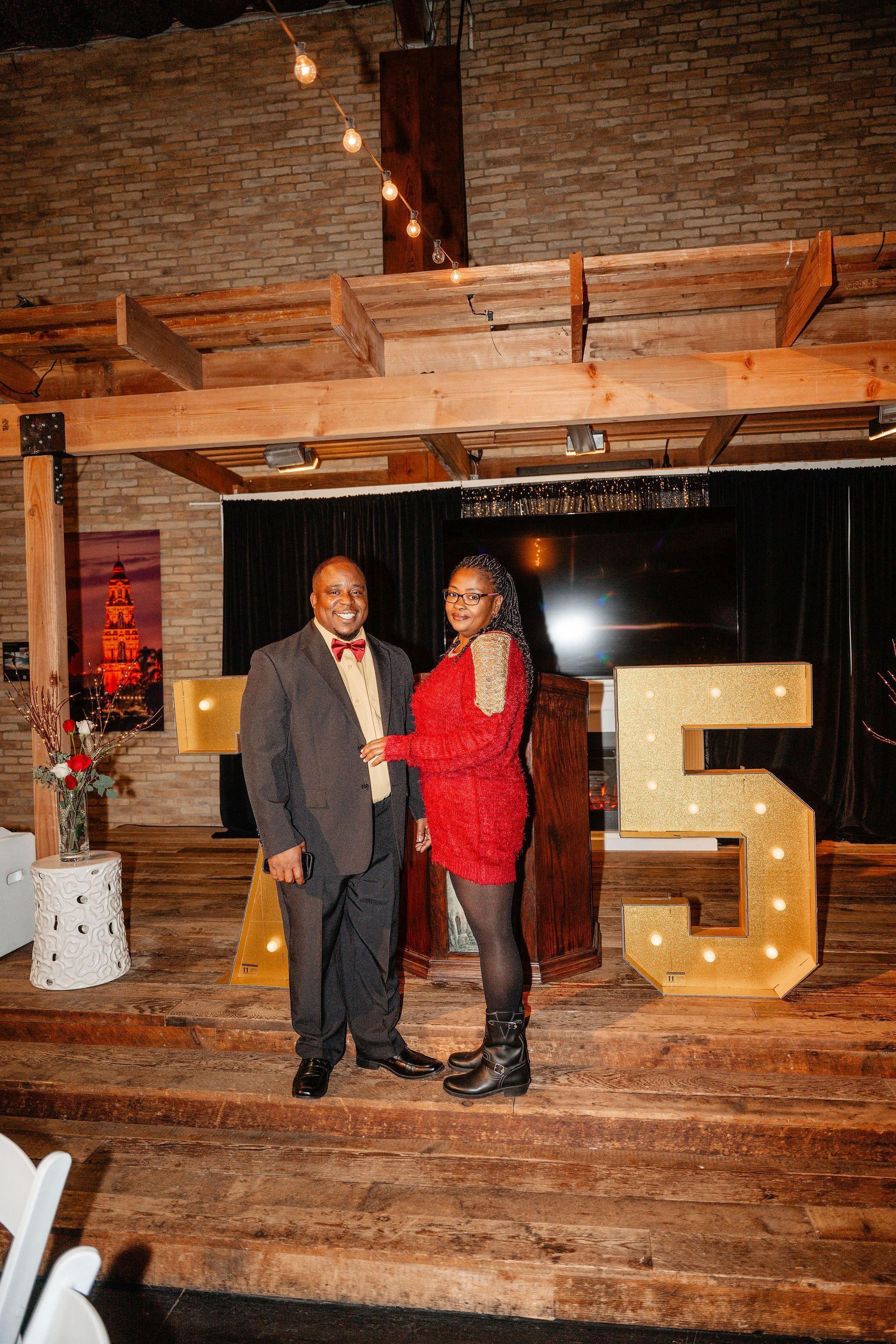 Couple standing by light-up 