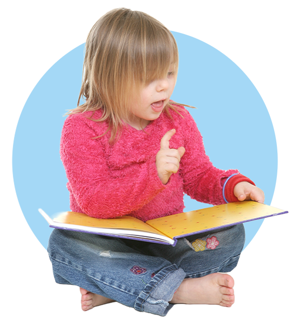 Young Girl Looking At A Book — Columbia, IL — Columbia Kinder College