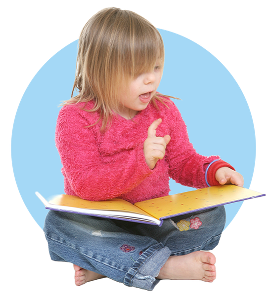 Young Girl Looking At A Book — Columbia, IL — Columbia Kinder College