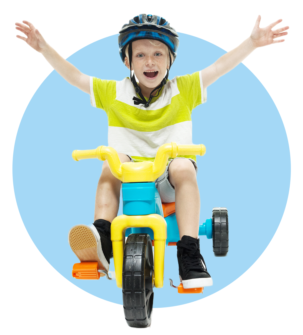 Cheerful Boy Riding A Tricycle — Columbia, IL — Columbia Kinder College