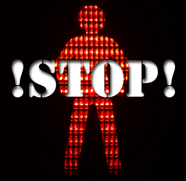 A red figure with '!STOP!' written over it. 
