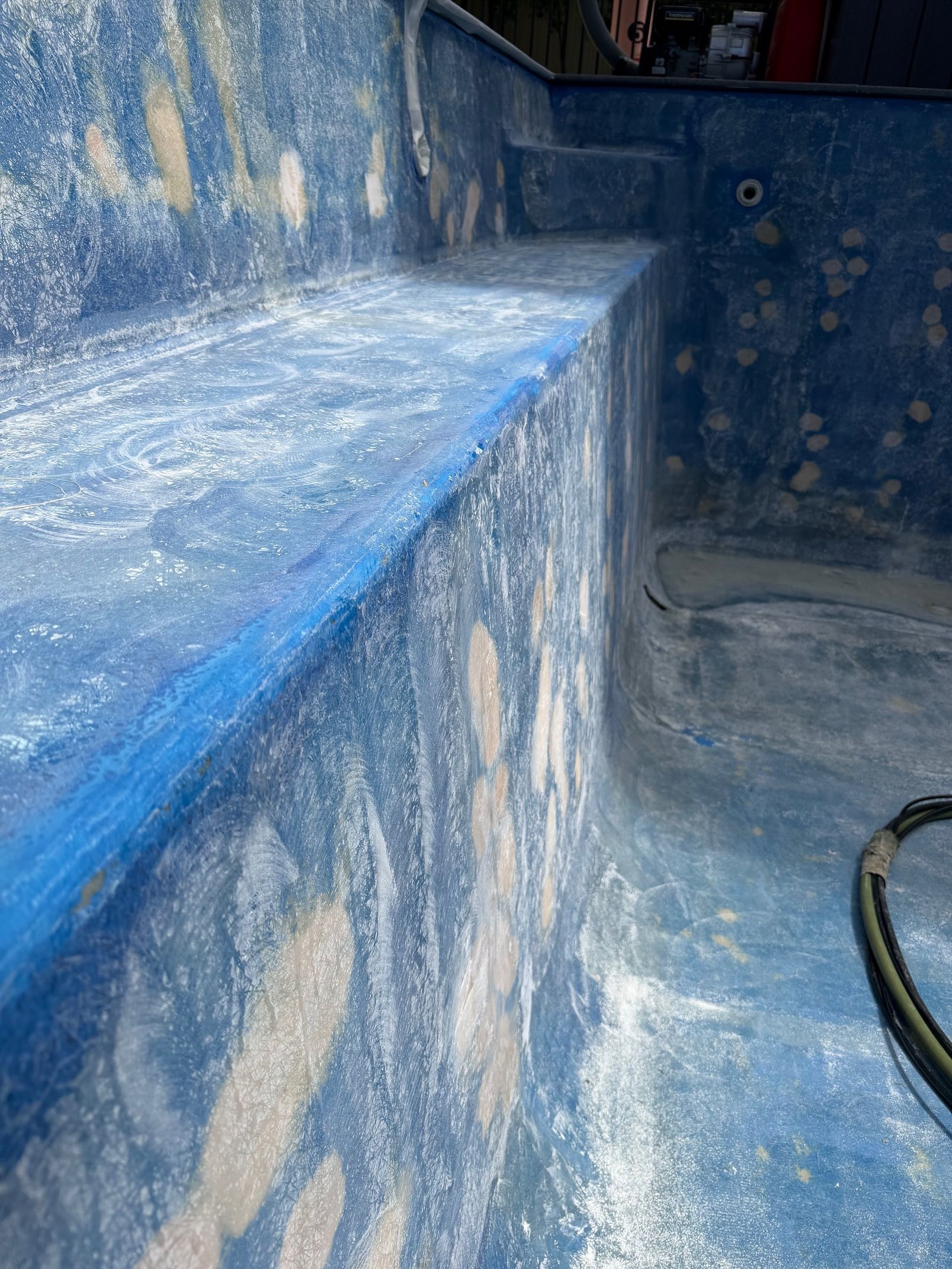 Blue-painted interior of a pool — East Coast Pool Resurfacing In Port Macquarie, NSW